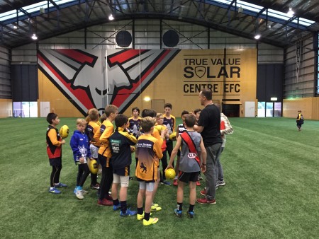 Coach's Pep Talk before Training in The Hangar - what a wonderful opportunity for our boys.